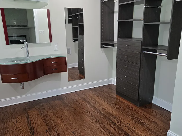Master bath with hanging shelves and bars