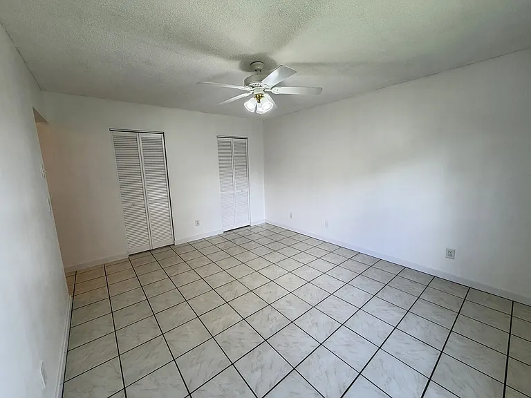Master bedroom with 2 walk in closets