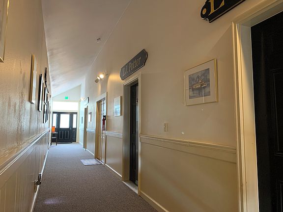 Hallway to 3 apartments. Shared washer and dryer in hallway.