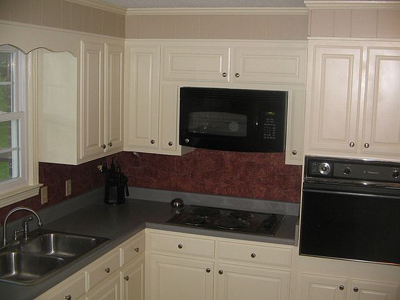 Updated kitchen with new microwave.