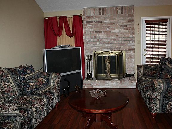 Family Room - rich laminate wood flooring.