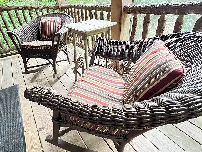 Comfortable wicker furniture for enjoying the serene environment.
