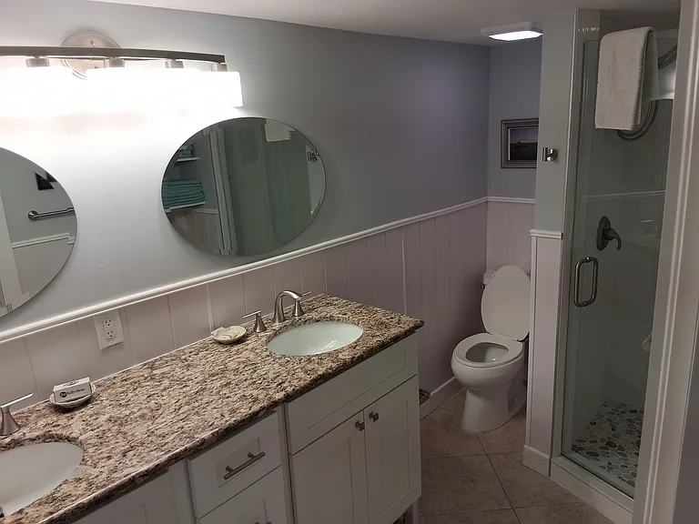 Full size master bath off bedroom-private from living room by sliding door.