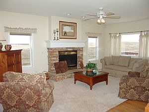 Formal living room with gas fireplace and great views