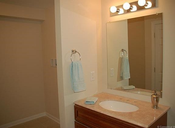 First floor half bath with large laundry room.