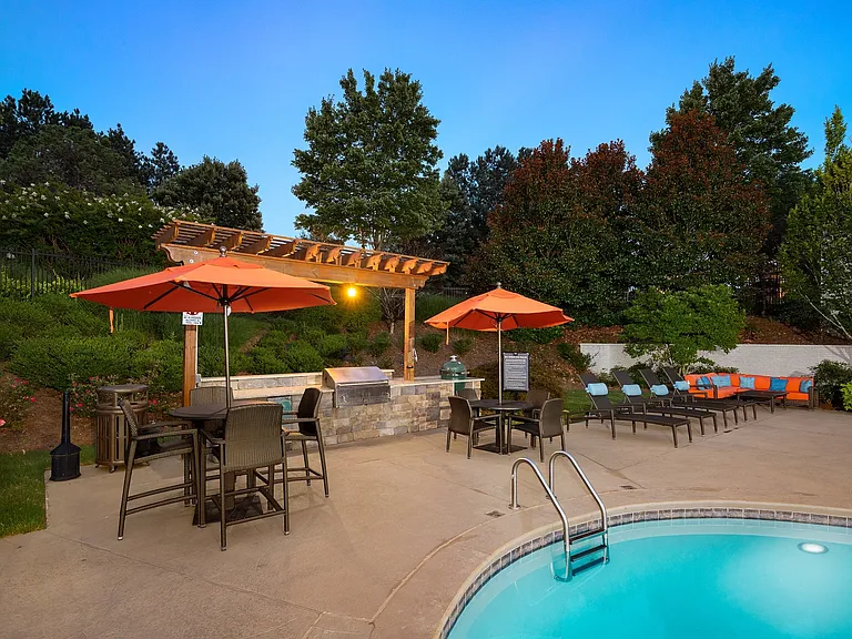 Outdoor entertainment space that's outfitted with a grilling station and abundant seating.