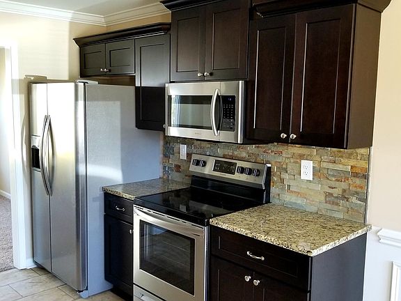 Kitchen with Stainless Steel Appliances, Granite and Backspl