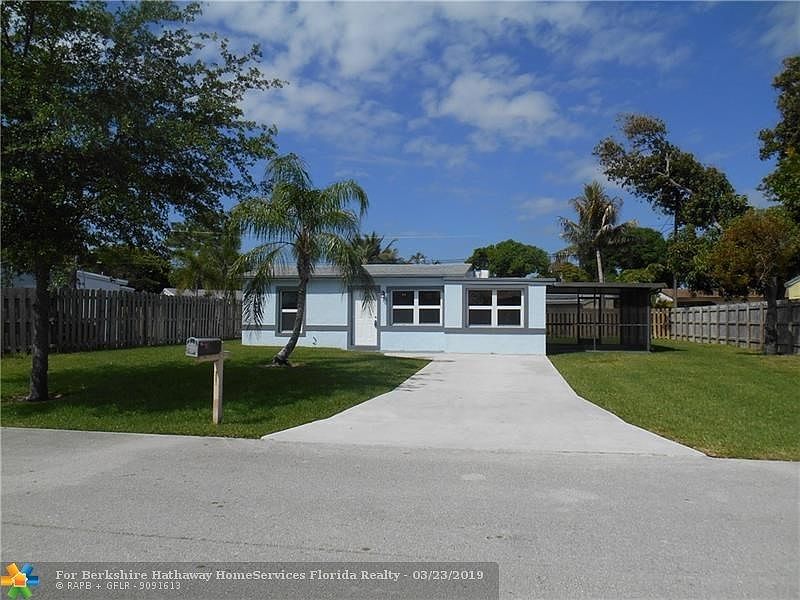 FRONT WITH SUPER LONG DRIVEWAY AND BEAUTIFUL LAWN