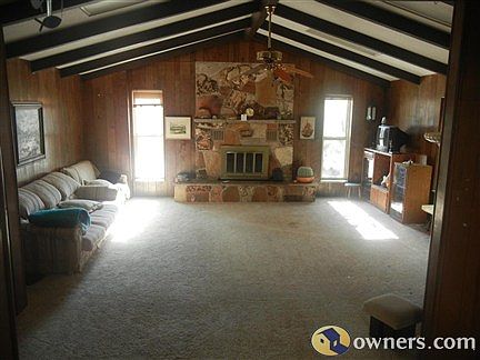 Living room with gas fireplace & natural rock