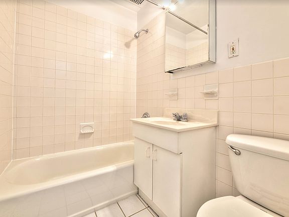 5th image of 225 E 10th St APT 2A
