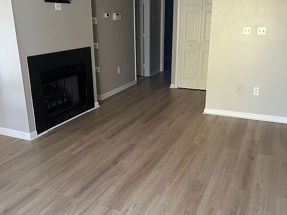 Updated floors throughout. Gas fireplace with large tv mount above