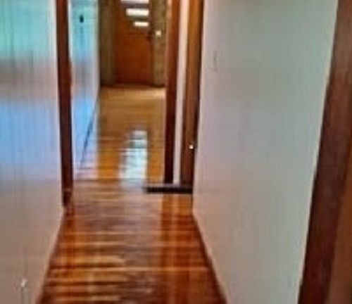 hallway, right leads to small downstairs and left goes to master bed/bath and main bath/laundry room