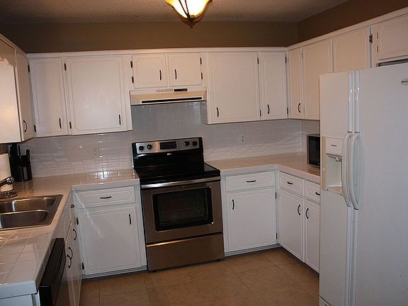 New Tile Counter Tops, New Blinds, New Lighting and Stainless Appliances