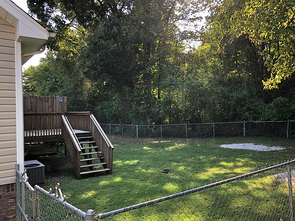 Private, fenced in backyard that backs up to wooded area.
