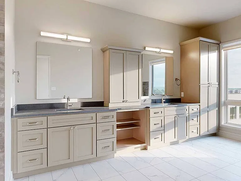 Experience spa-level luxury in the Wrangler Penthouse, where the expansive primary bathroom features double vanities, premium finishes, and timeless design.