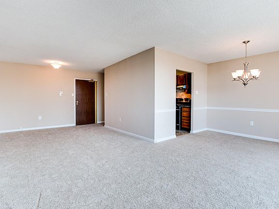 View of living spaces and front door from sliders