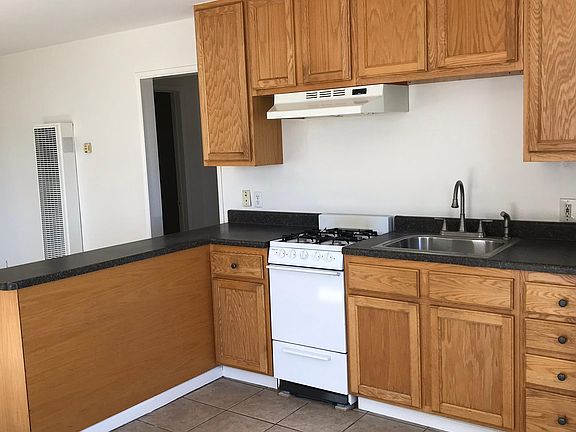 The kitchen of the apartment. A refrigerator is included, but there is no dishwasher. There is ample room for a table.