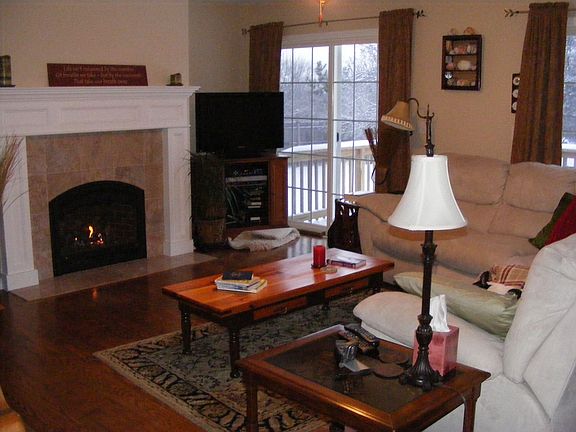 Living Room w/Marble Fireplace and two sliders to rear deck
