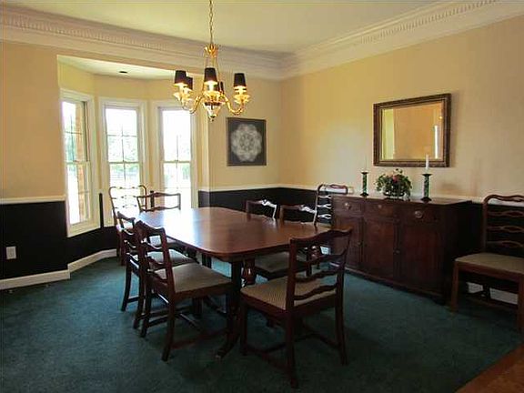 Large & beautiful dining room has just been painted.  Bay window is a nice touch that brings lots of light into this room
