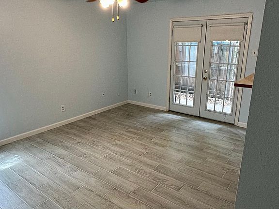 Natural light, living area with plank flooring.
