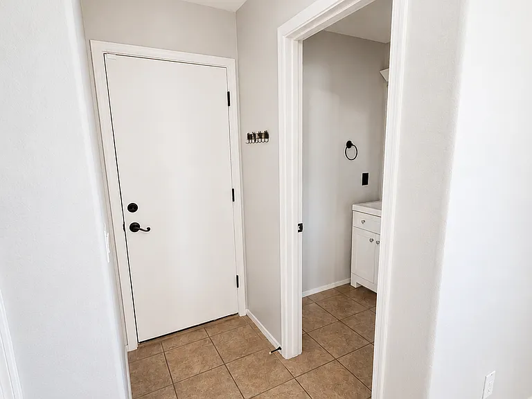 Downstairs bathroom and garage door.