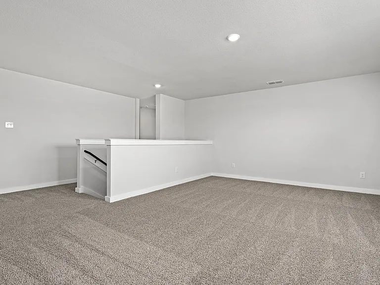 Upstairs, the gameroom loft is an extended, versatile living space.