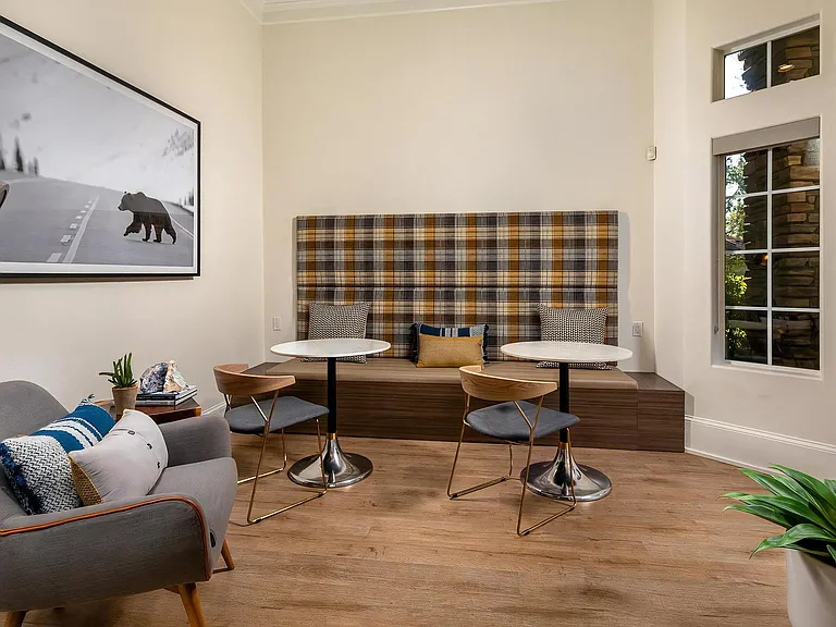 Cozy Clubhouse Lounge with Built-In Banquette Seating and Modern Furnishings