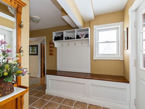 Mudroom/foyer with built in bench