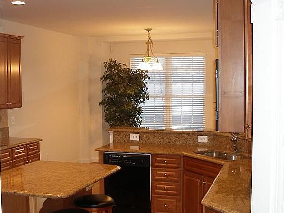 View into Kitchen from Foyer and Formal Dining Room
