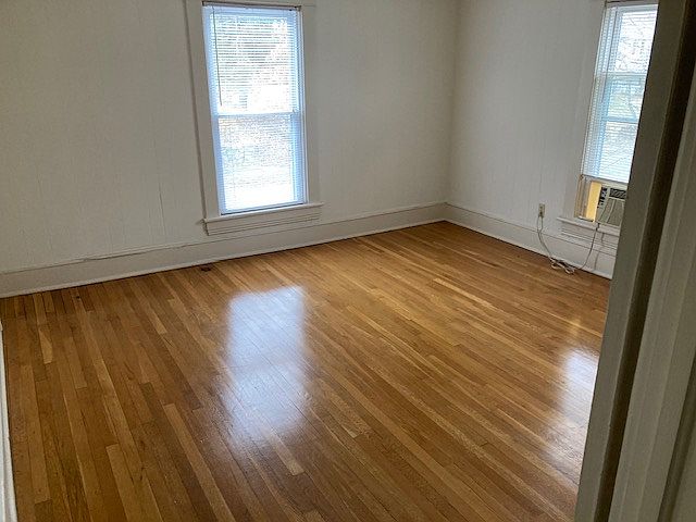 Bedroom 14 by 14 with ceiling fan and hardwood floor