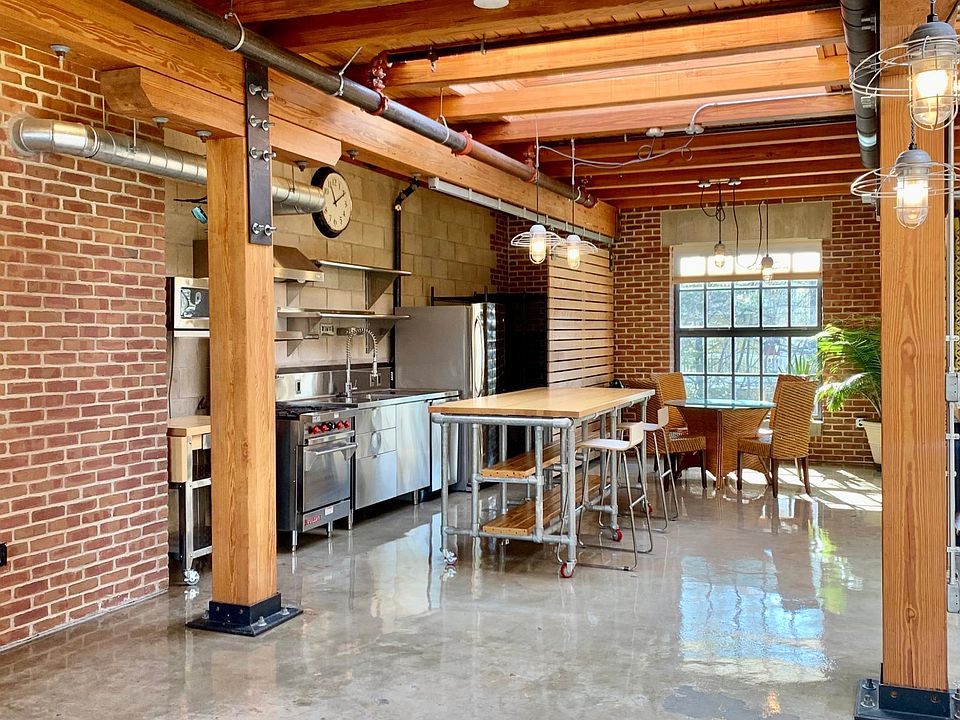 Open kitchen with massive island which stays with unit