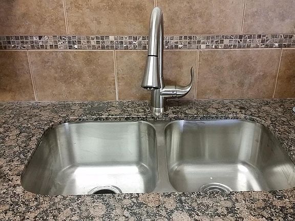 Beautiful Granite and tile backsplash