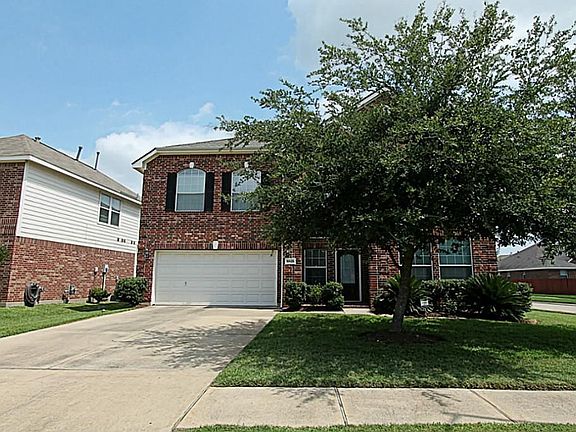 THIS GRACEFUL HOME IS ON A CORNER LOT IN VILLAGES OF LANGHAM CREEK