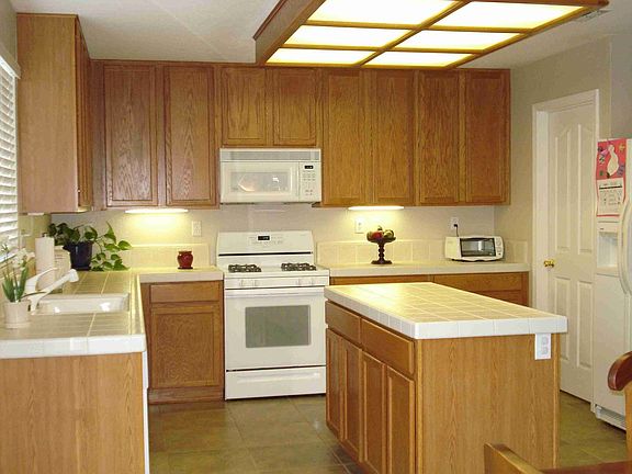 Lots of storage upgraded textured tile counters and floors