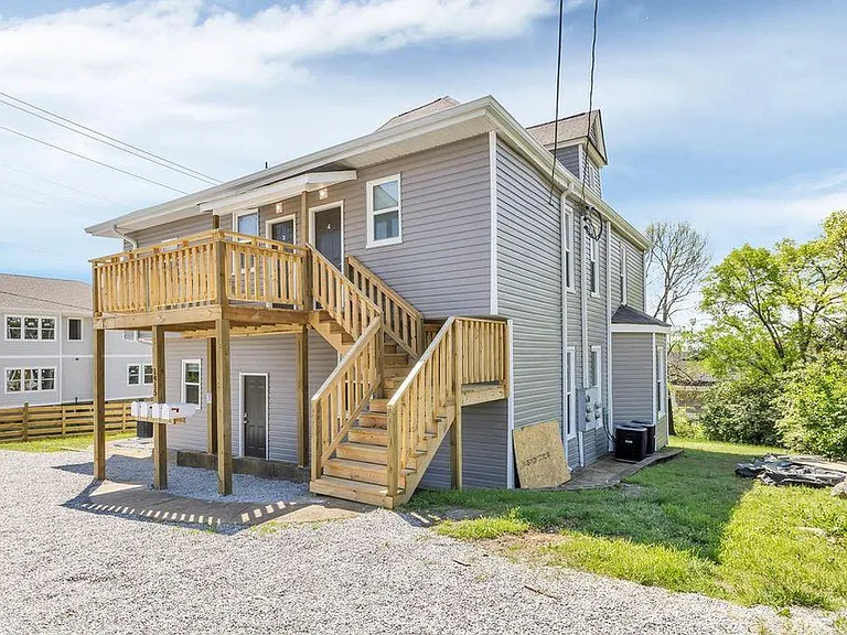 rear private apartment access with upstairs porch area for table and chairs.