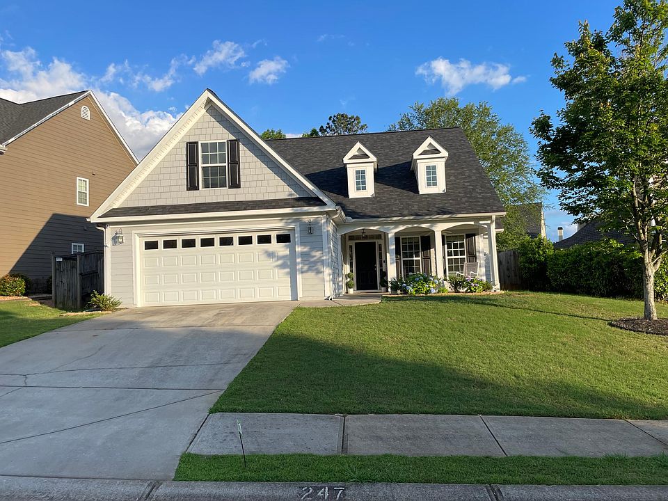 Front of house. Driveway fits two cars, and garage fits 2 cars.