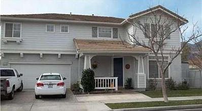 Lovely front view of this 2355 Sq. Ft. 2 story home!  5 Bedrooms (1 makes great office), 2-1/2 baths, living room AND large family room with fireplace, tiled kitchen with island & bar!  2 car attached garage PLUS room for small R.V.  Back yard has nice pa