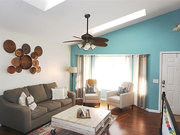 Living room has 2 skylights and a bay window.