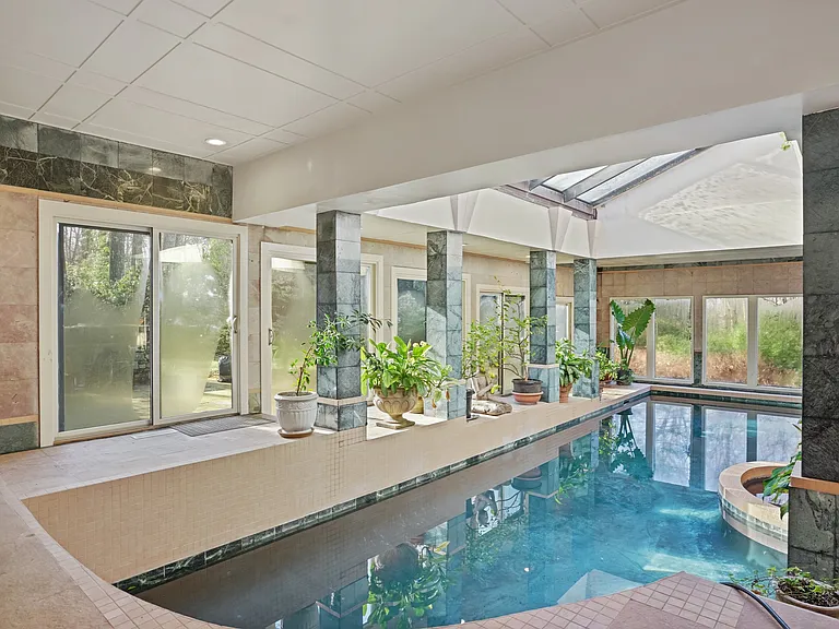 The polished concrete Pool, uses bromine (much less harsh on the eyes than chorine!).