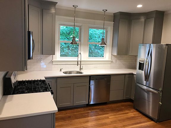 Kitchen with stailness steel appliances and garbage dispostal