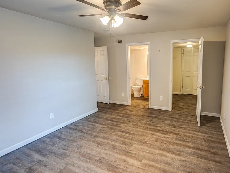 Primary bedroom with full bathroom and walk in closet