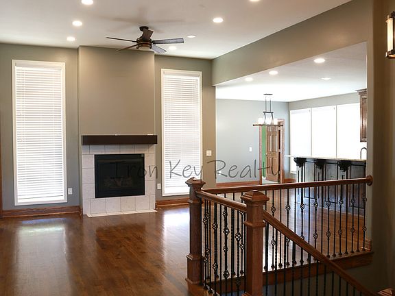Open floor plan with custom hardwoods and 10ft ceilings