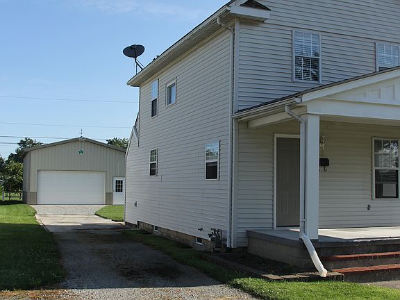 Side view, w/ garage behind