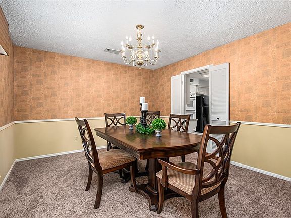 Enjoy dinner guests in this elegant formal dining room! Notice the double doors leading to the kitchen.