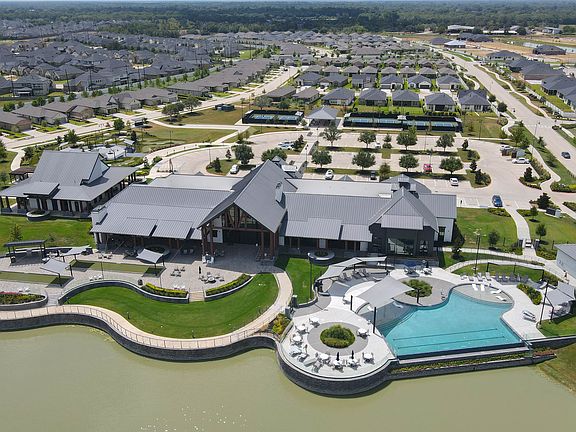 Resort-style clubhouse with pool and lakefront views