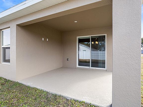 Your living space extends outdoors to a covered lanai - Parsyn by Highland Homes