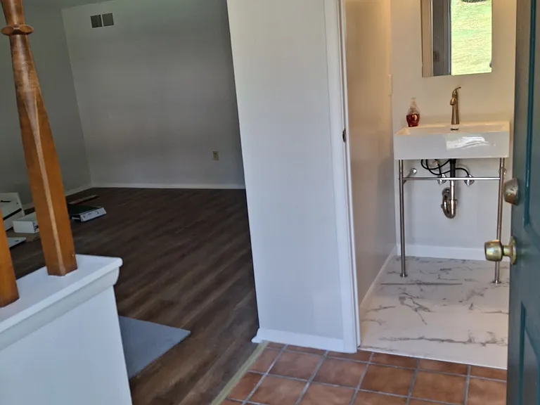 New Powder room near front entrance and Living Room