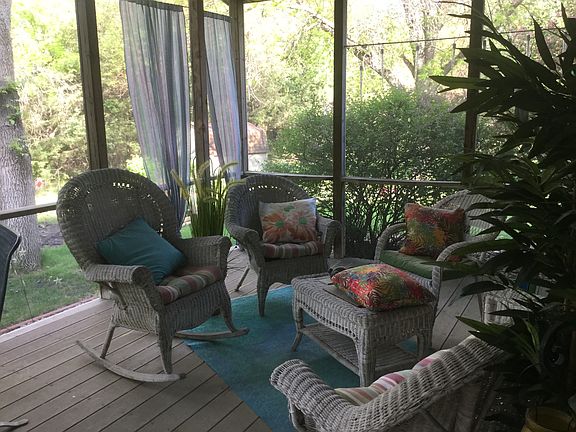 Screen patio faces woods off