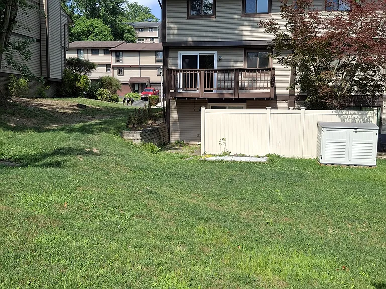 End unit. Private patio below deck with relaxing view.