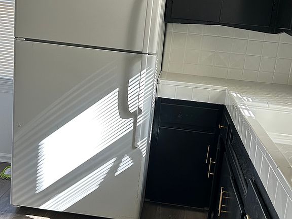 Functional kitchen layout with ample cabinet storage and prep space